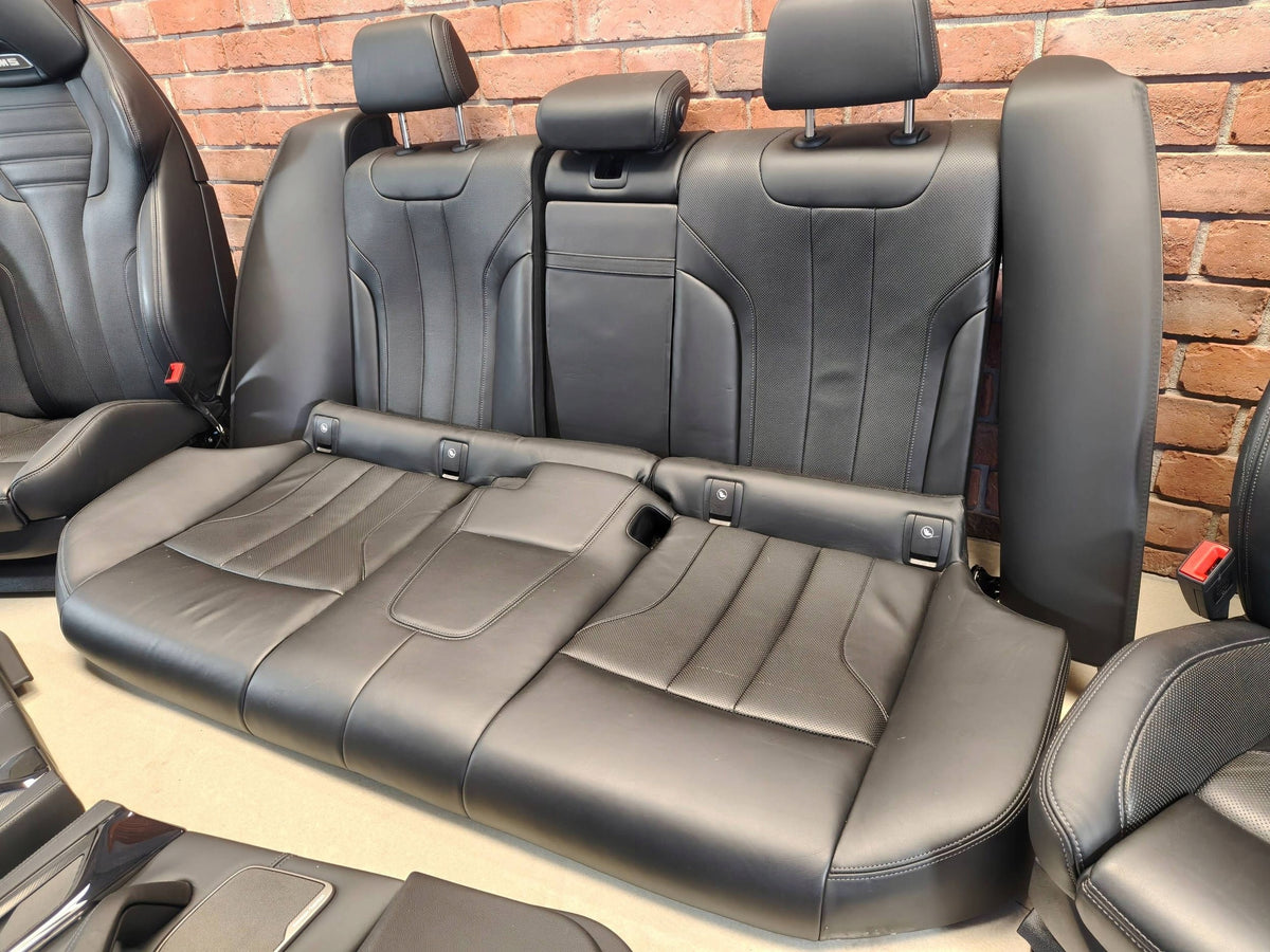 BMW M5 F90 – sorte Merino M-sæder med ventilation og dørsider – uden airbags – foto 4, konkret brugt del; stand og mærkninger bevaret