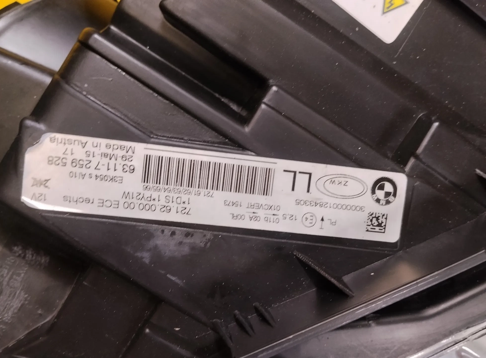 Original BMW/ZKW-etiket på højre adaptiv bi-xenon-forlygte: 63117259528, 721.62.000.00, ECE rechts/LL